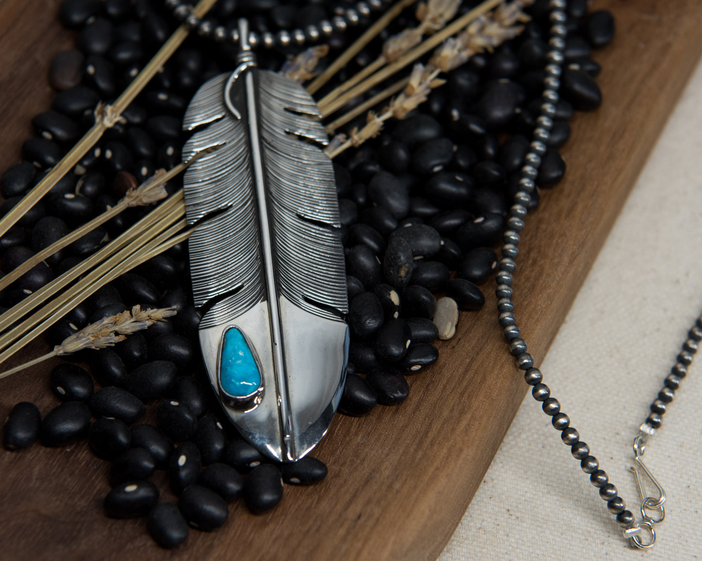 Kingman turquoise feather necklace on Navajo Pearl strand, sterling silver