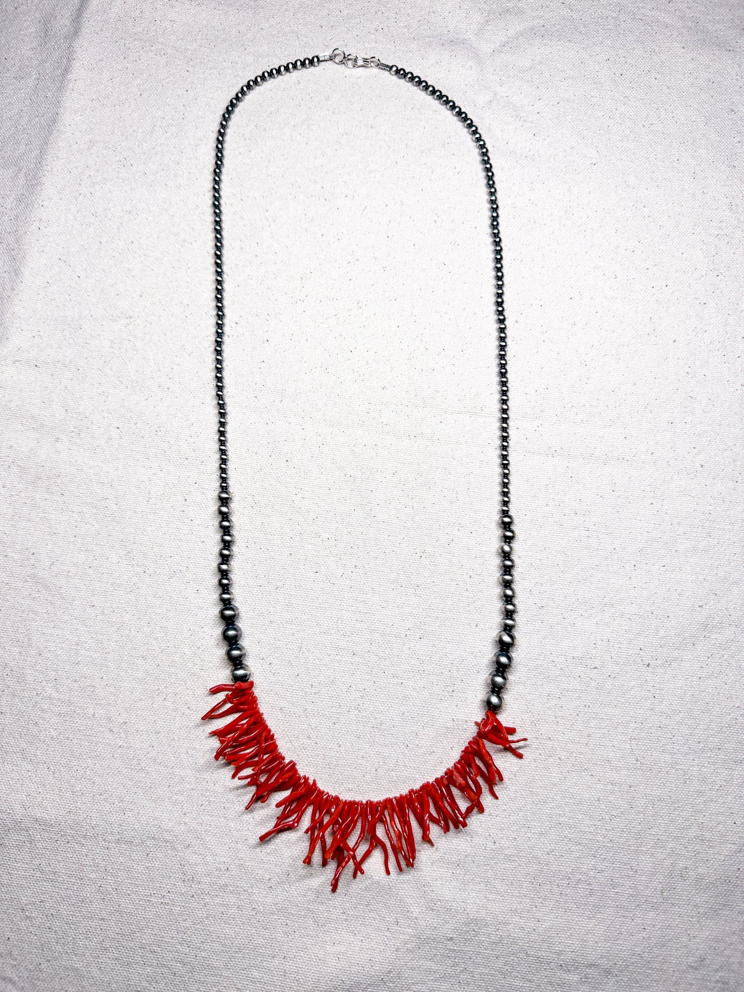Coral and sterling silver necklace, detail view