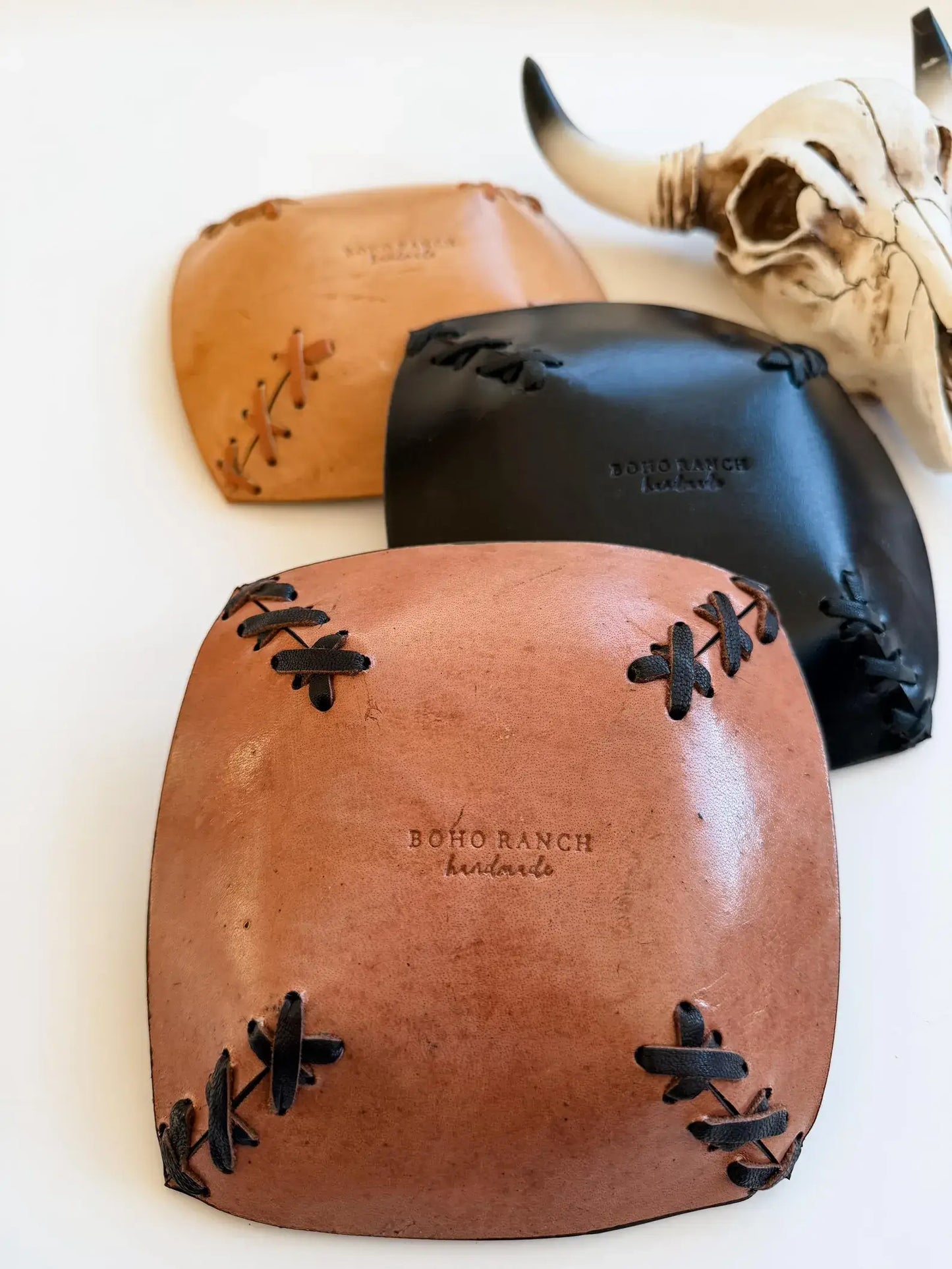 Cowhide and leather catch-all tray, side view