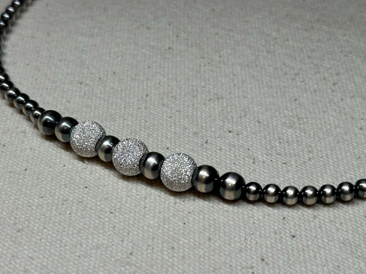 Sterling silver pearl necklace, detail view