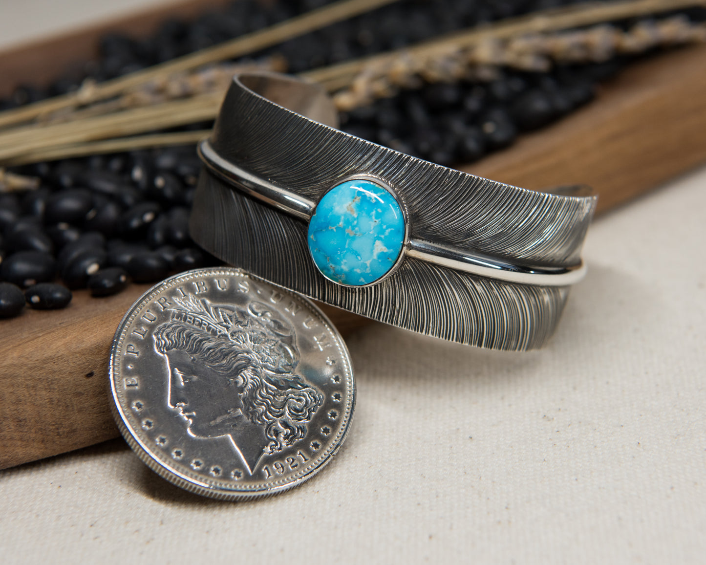 Kingman turquoise stamped feather cuff by Angela Martin