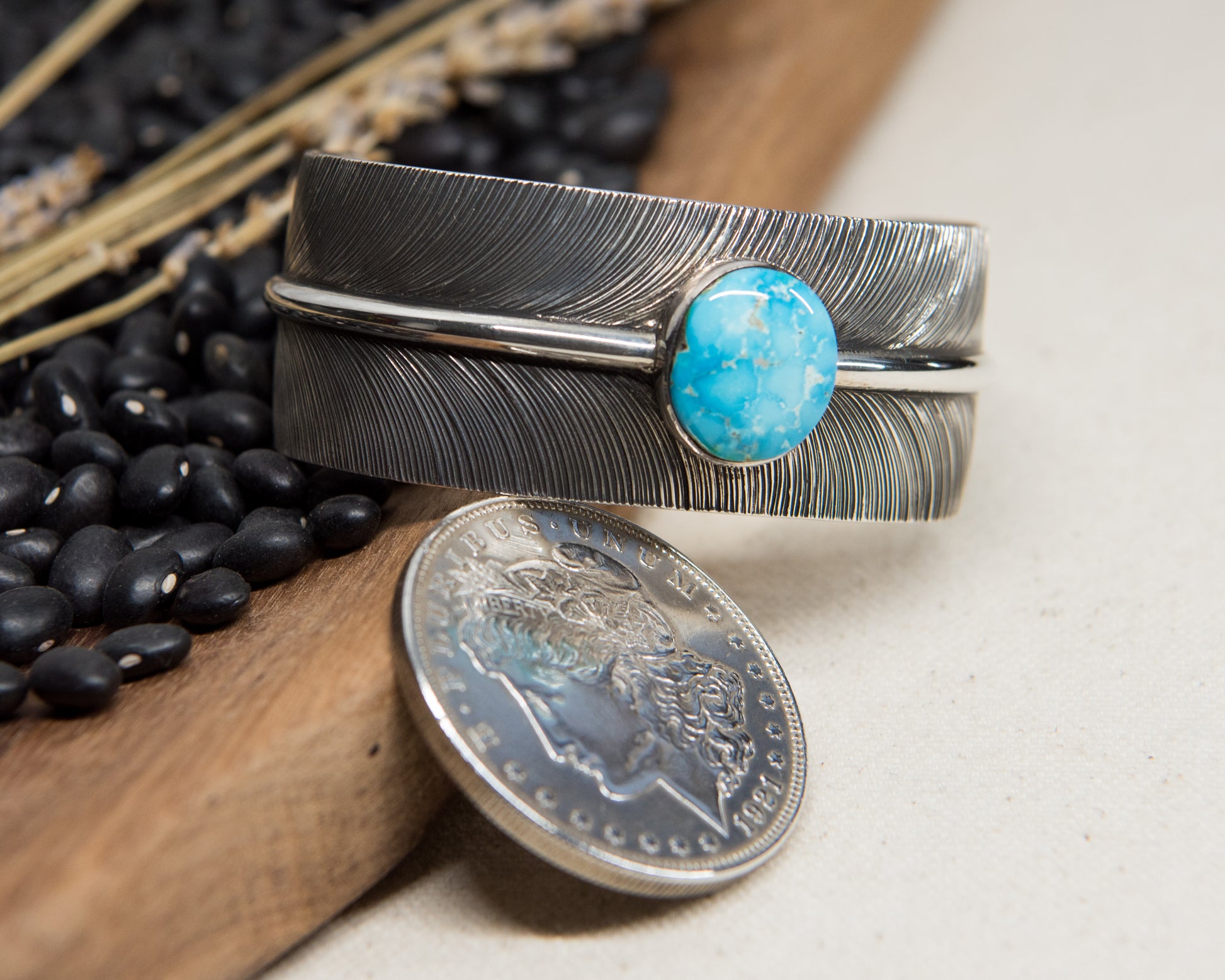 Kingman turquoise stamped feather cuff, detail view