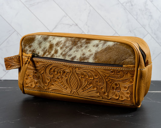 Hand-tooled cowhide toiletry travel bag
