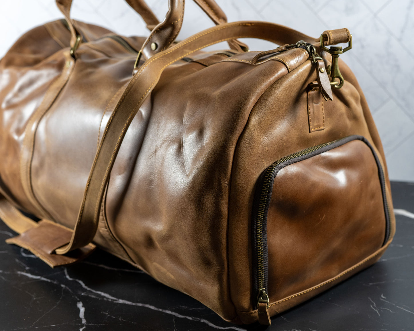 Genuine leather duffle travel bag, close-up of leather grain