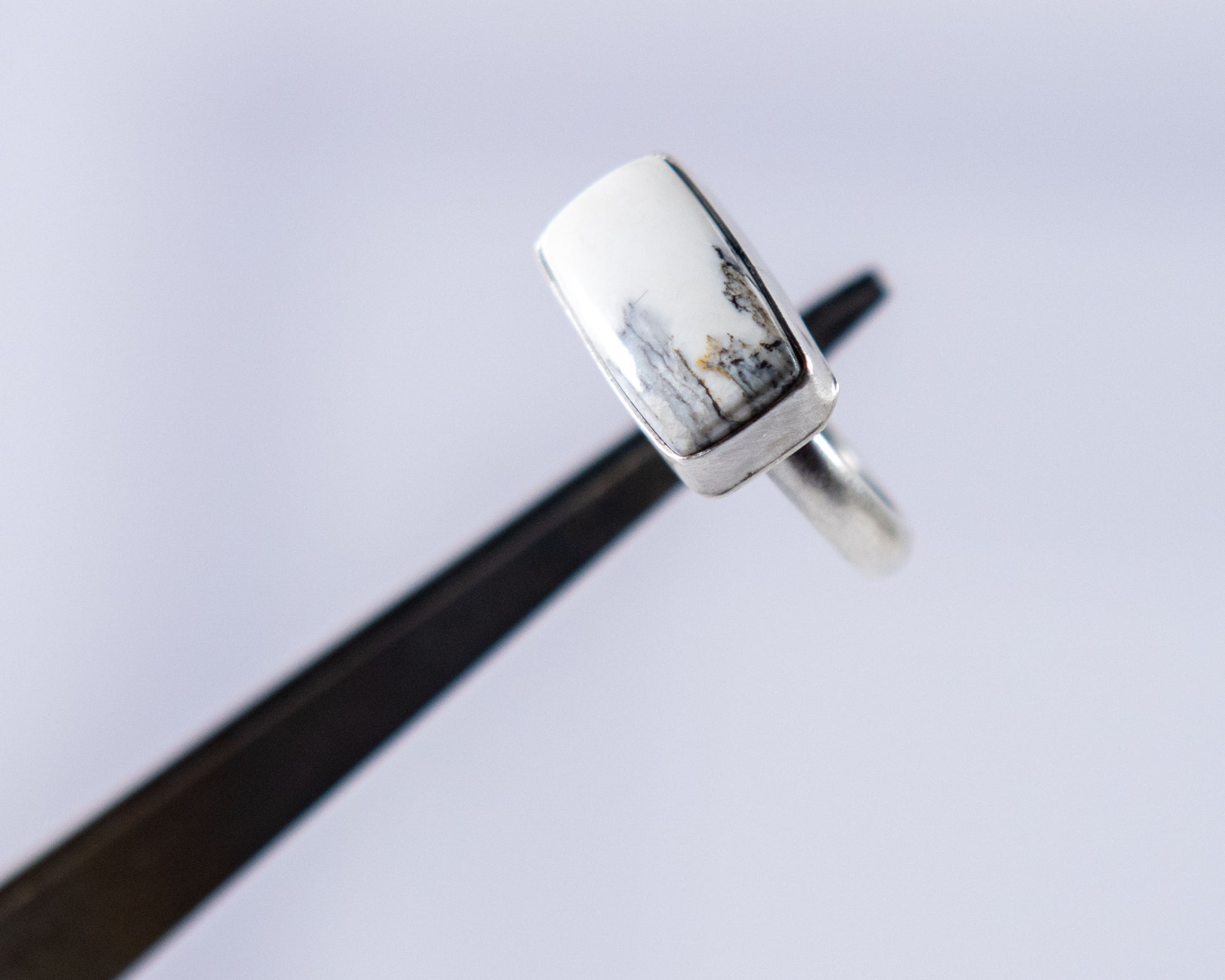 Black and white stacker ring by P. Yazzie, close-up