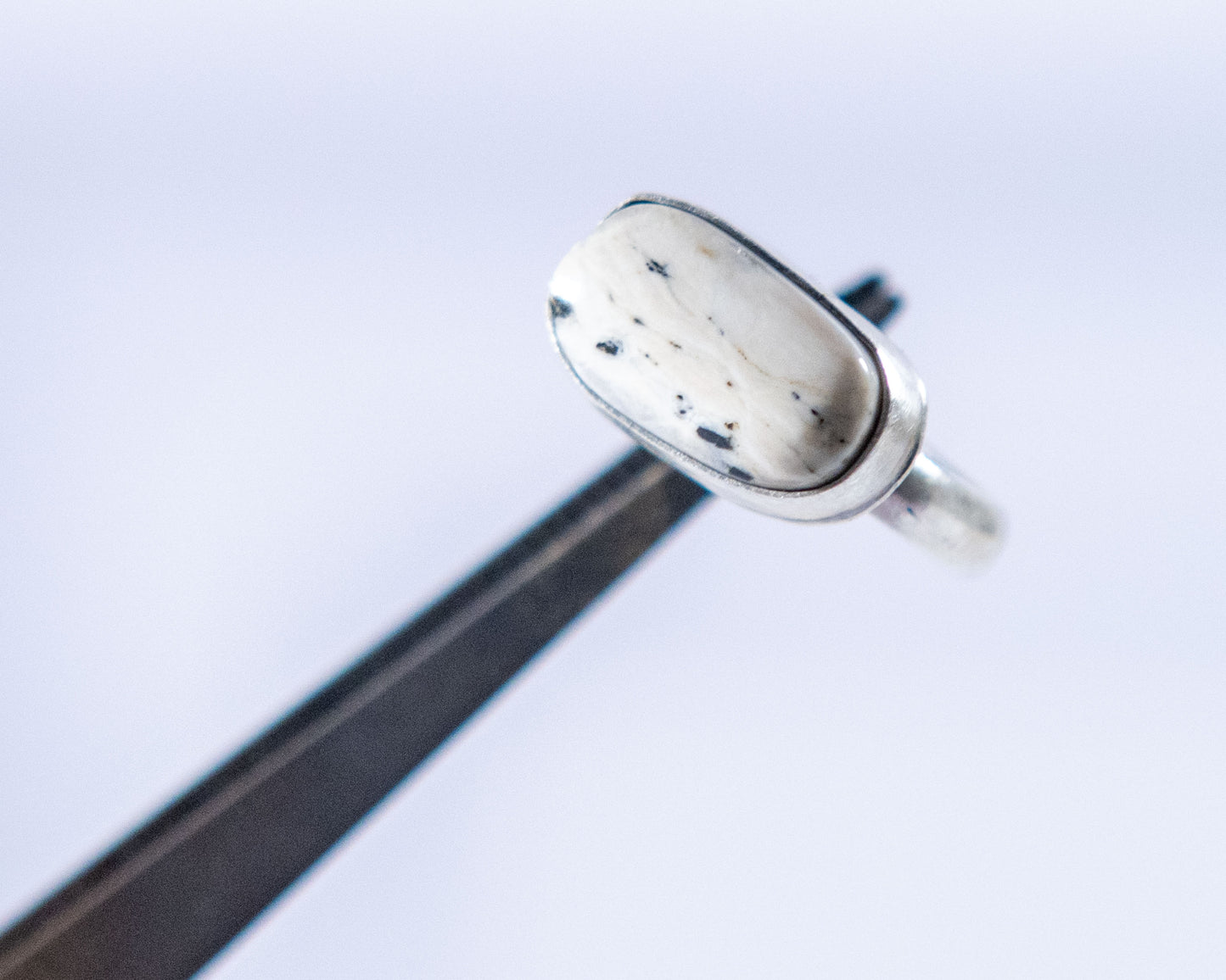 Black and white stacker ring by P. Yazzie, side view