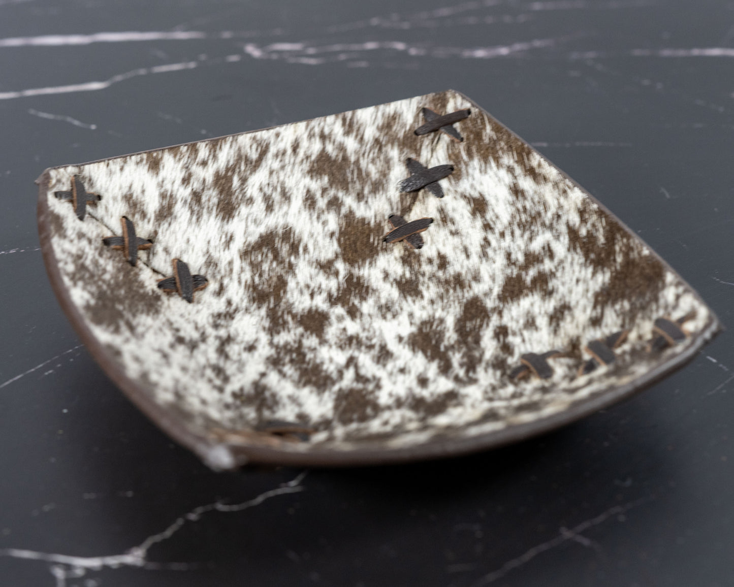 Cowhide and leather catch-all tray, detail view